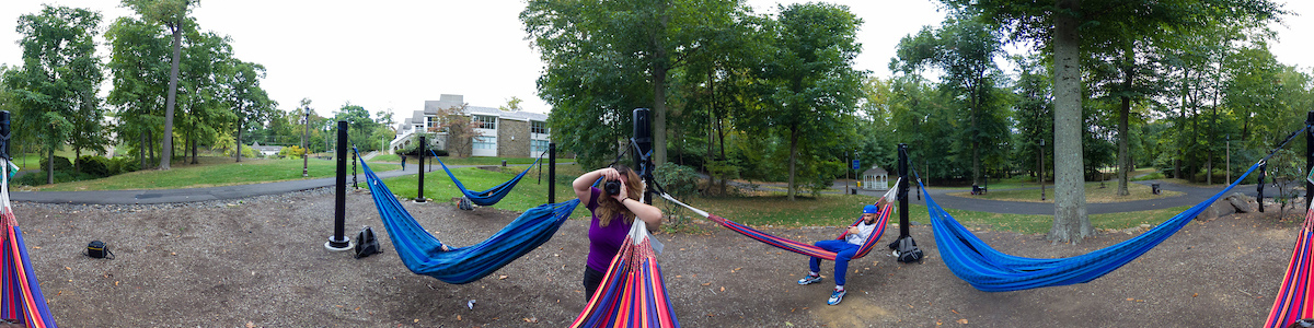 student snapping a photo with her camera