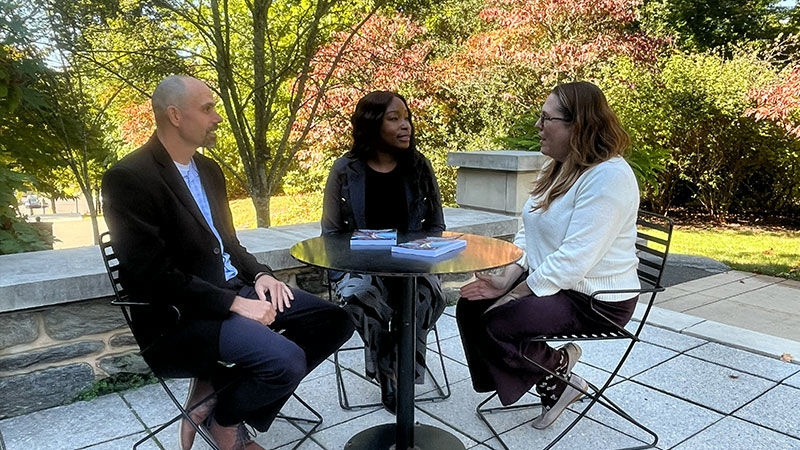 Three people sitting at a table