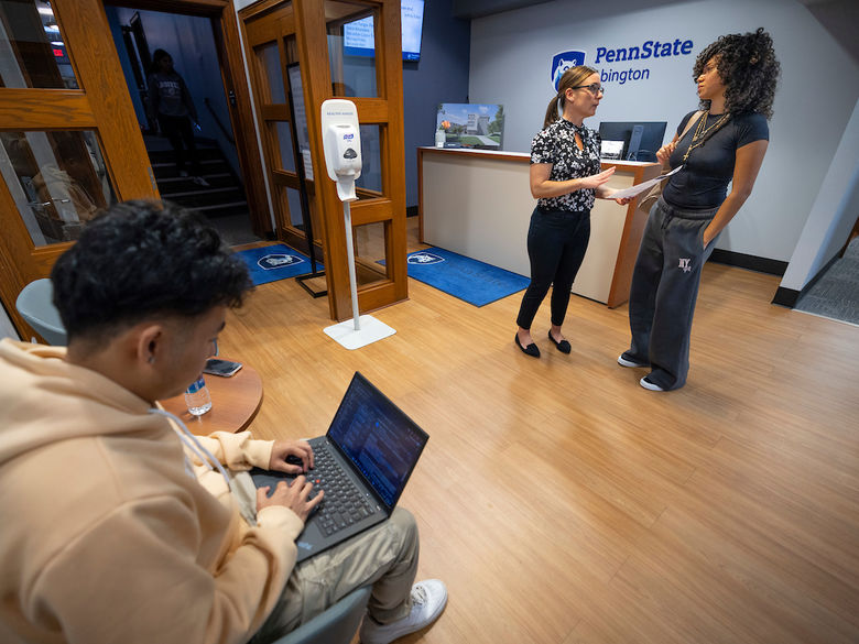 two students in the admissions office