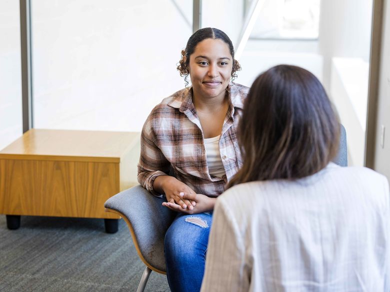 student talking to counselor 