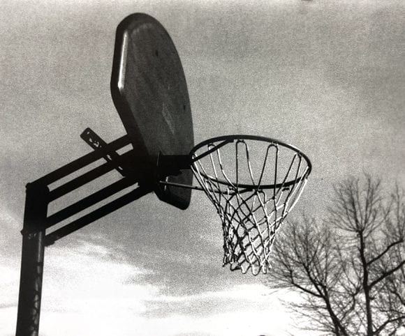 black and white photograph basketball net