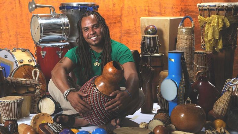 Man surrounded by percussion instruments