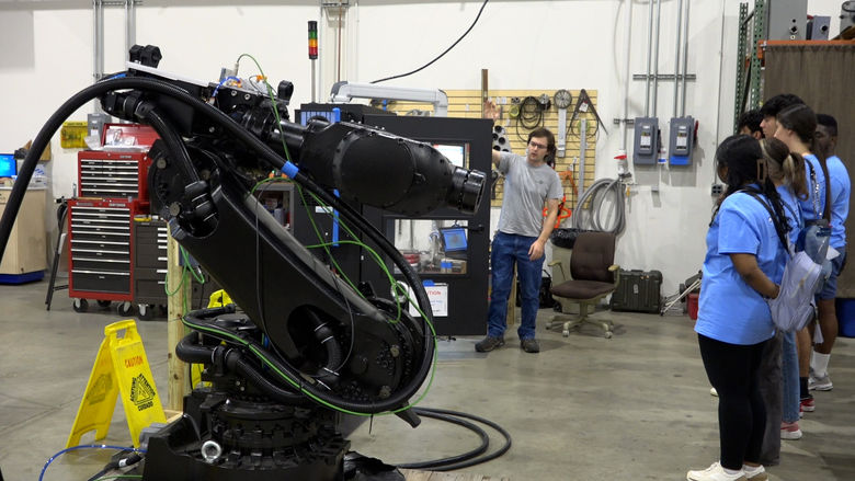 students looking at machinery 