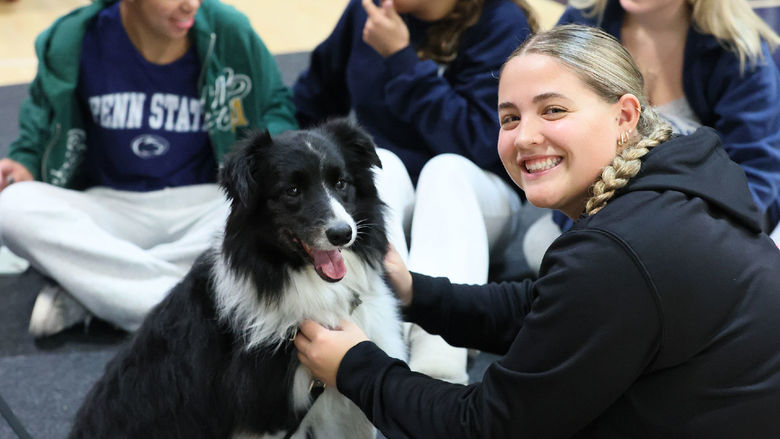 Black and white dog with young woman