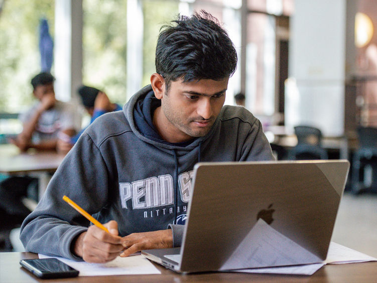 Student working on a laptop