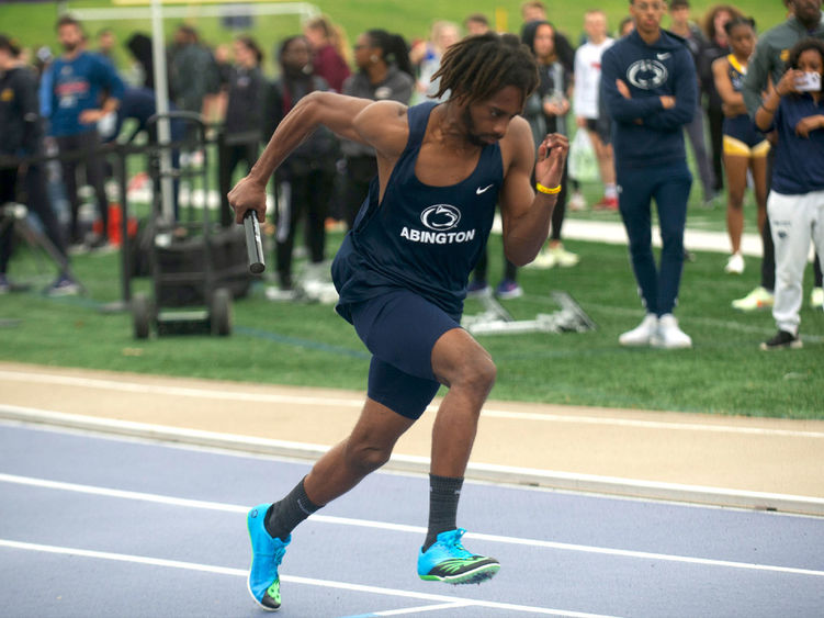 Student running in a track meet